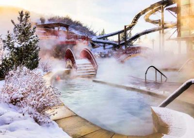 Fresh snow covers the outdoor pool area.