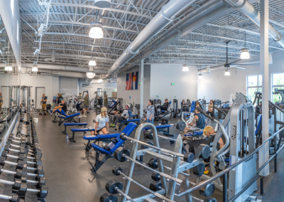 lots of people using free weights and machines in the fitness center at Old Town Hot Springs