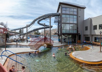 overview of slides and hot pools at Old Town Hot Springs featuring families and kids swimming