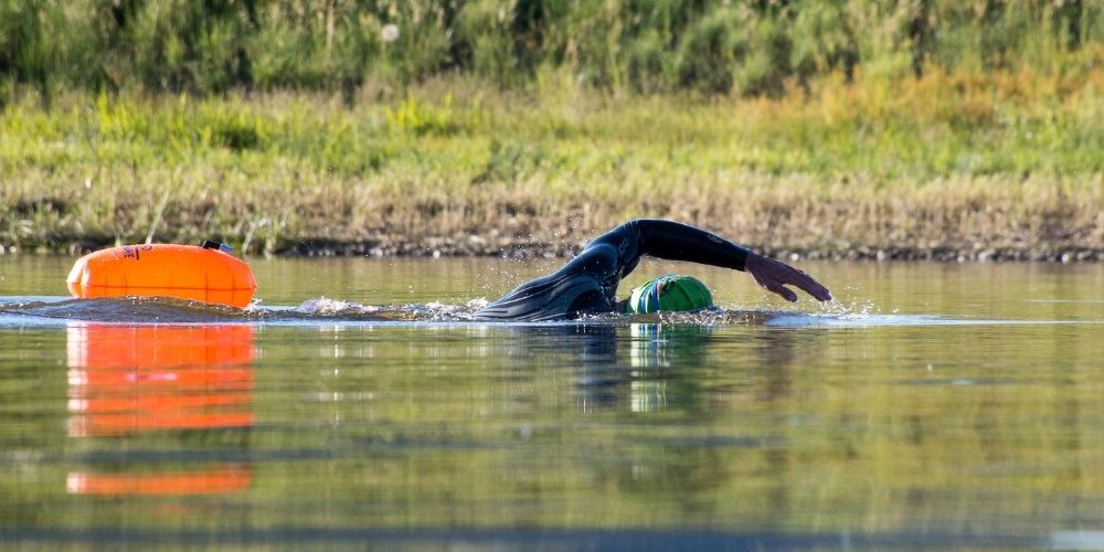 Aquatics Man swimming in lake