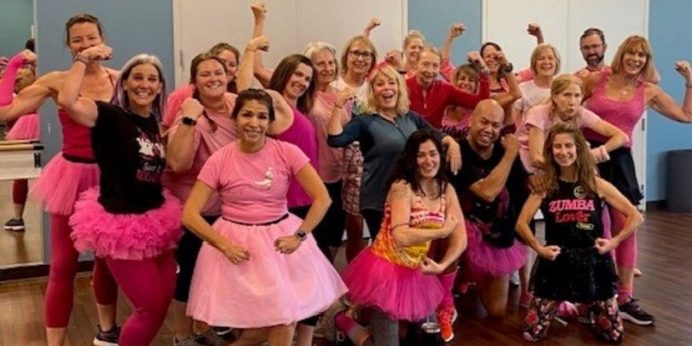 Fitness & Wellness Zumba Pink class participants pose for a picture after class