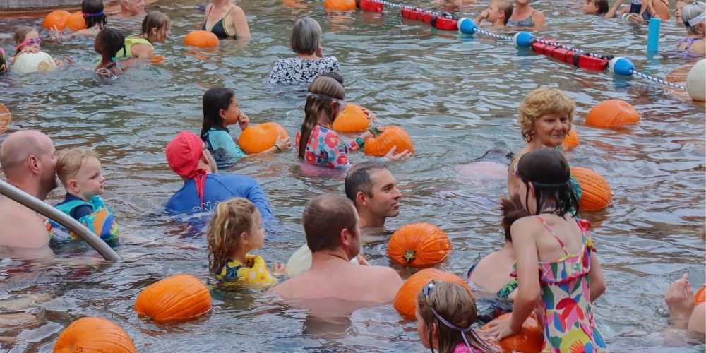 Pumpkin Float Kids and adults dive for pumkins at the annual Pumpkin Float event