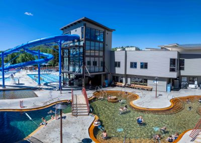 Visitors and members enjoy the hot pool on a summer day at Old Town Hot Springs.