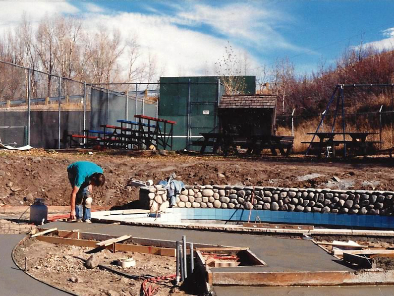 From from 1988 of women coming out to water slide and people enjoying the pools.