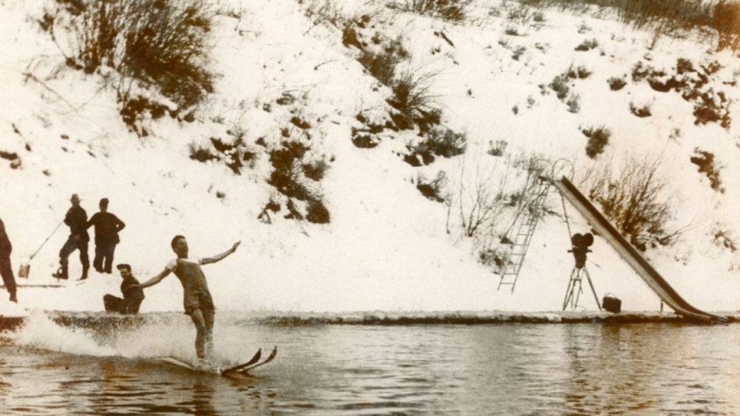 A skier glides across the hot springs pool in the 1940s.